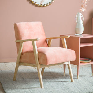 blush armchair with wooden frame