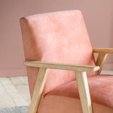 blush armchair with wooden frame
