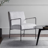 black metal framed armchair with soft grey upholstery