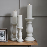 a matt white ceramic pillar candle holder