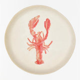 Round off white plate with a red lobster design