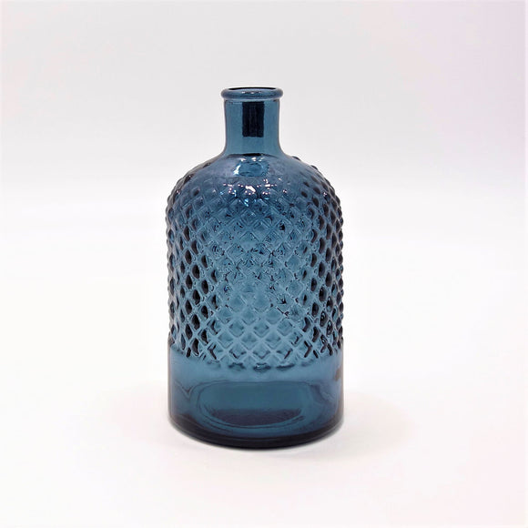 This diamond embossed bottle in petrol blue is made from 100% recycled glass. Ideal for use as a carafe, with a single stem of greenery or simply place it on a shelf or kitchen worktop for a touch of colour and texture.