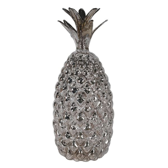 a glass pineapple with antique silver finish